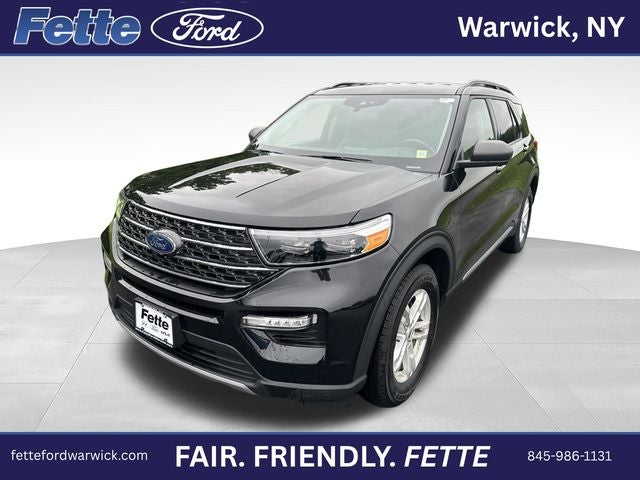 2023 Ford Explorer XLT in Agate Black Metallic — front three-quarter view
