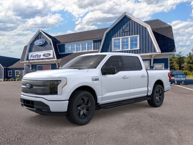 2025 Ford F-150 Lightning Flash in Space White Metallic — front three-quarter view