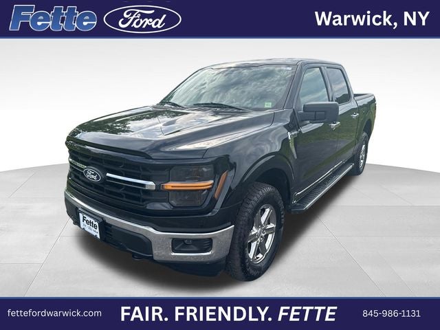 2025 Ford F-150 XLT in Agate Black Metallic — front three-quarter view