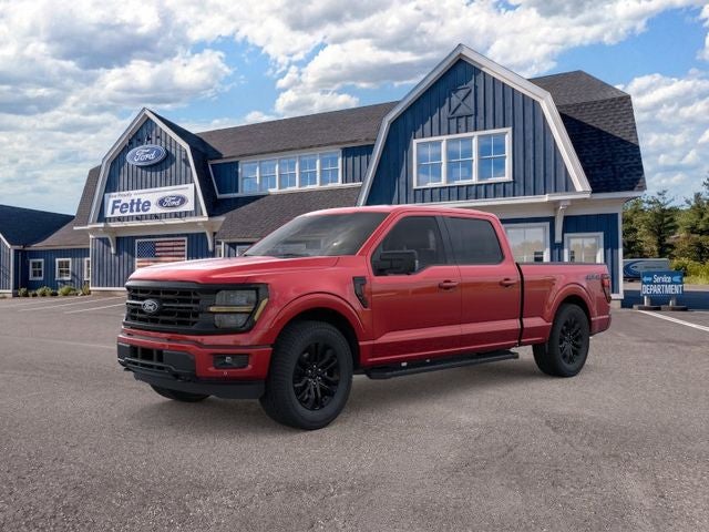 2026 Ford F-150 XLT in Ruby Red Metallic Tinted Clearcoat — front three-quarter view